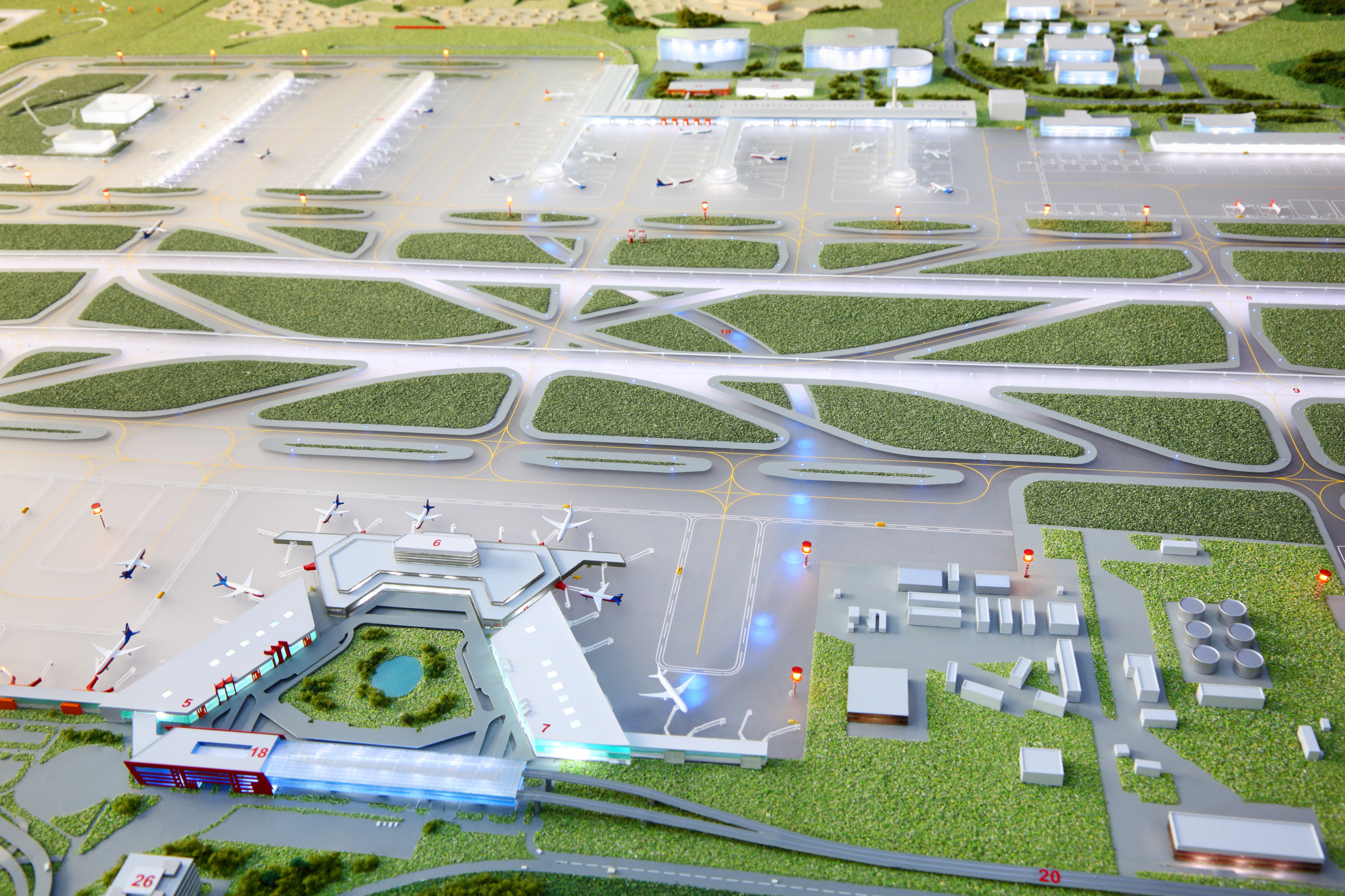 Model of airport seen from above with terminal and runways